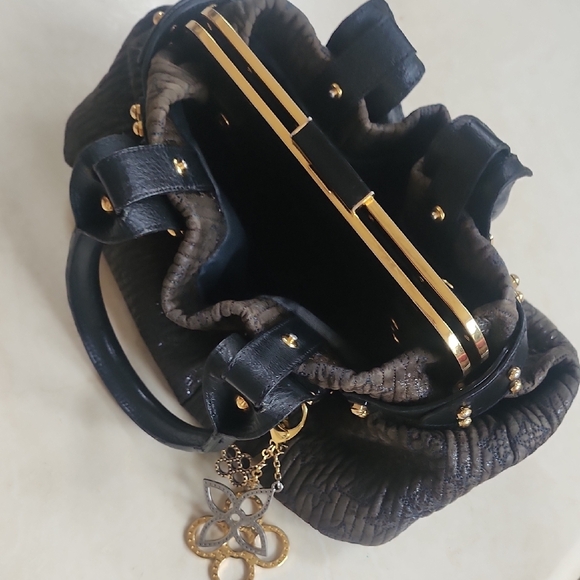 Louis Vuitton Motard Bike bag year 2007 Elegant Black Handbag with Gold Accents - Picture 7 of 10